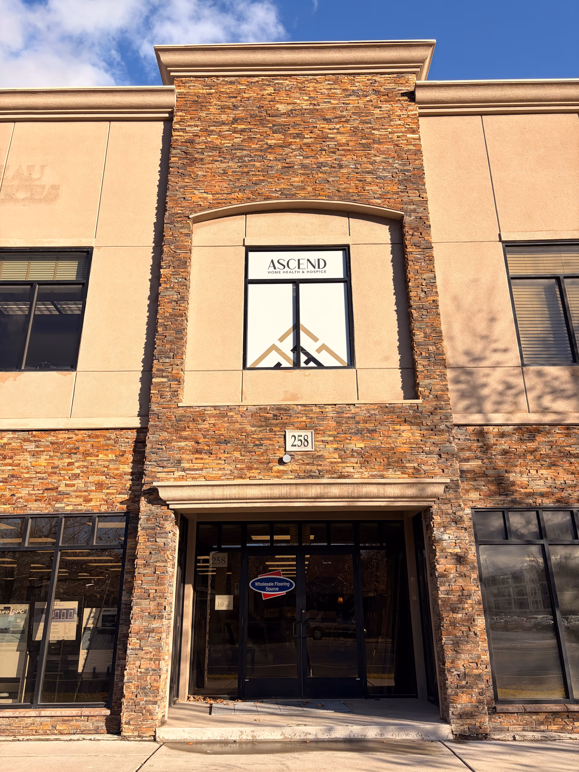 Front view of Ascend Home Health & Hospice building with stone facade.