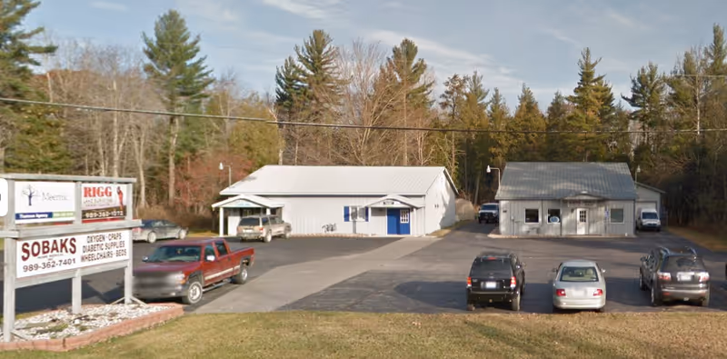 Exterior view of Sobaks Home Medical, Inc. building with a parking lot.