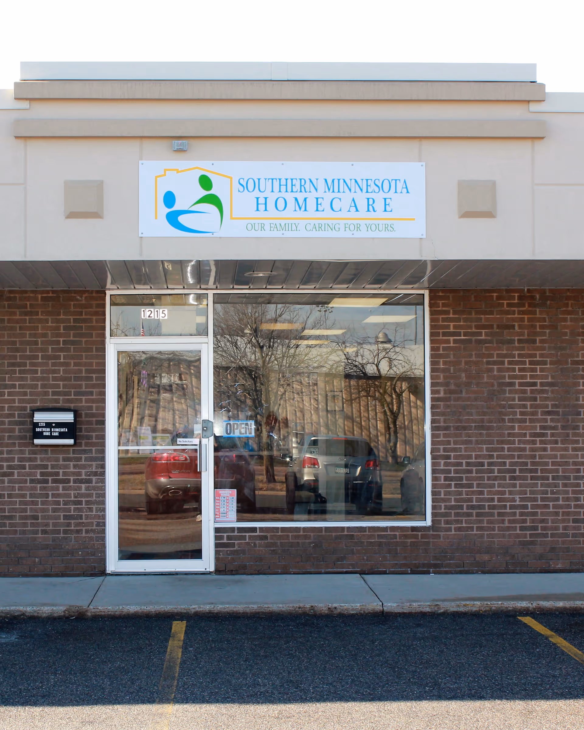 Front exterior of a brick facility with a Southern Minnesota Home Care sign above entrance.