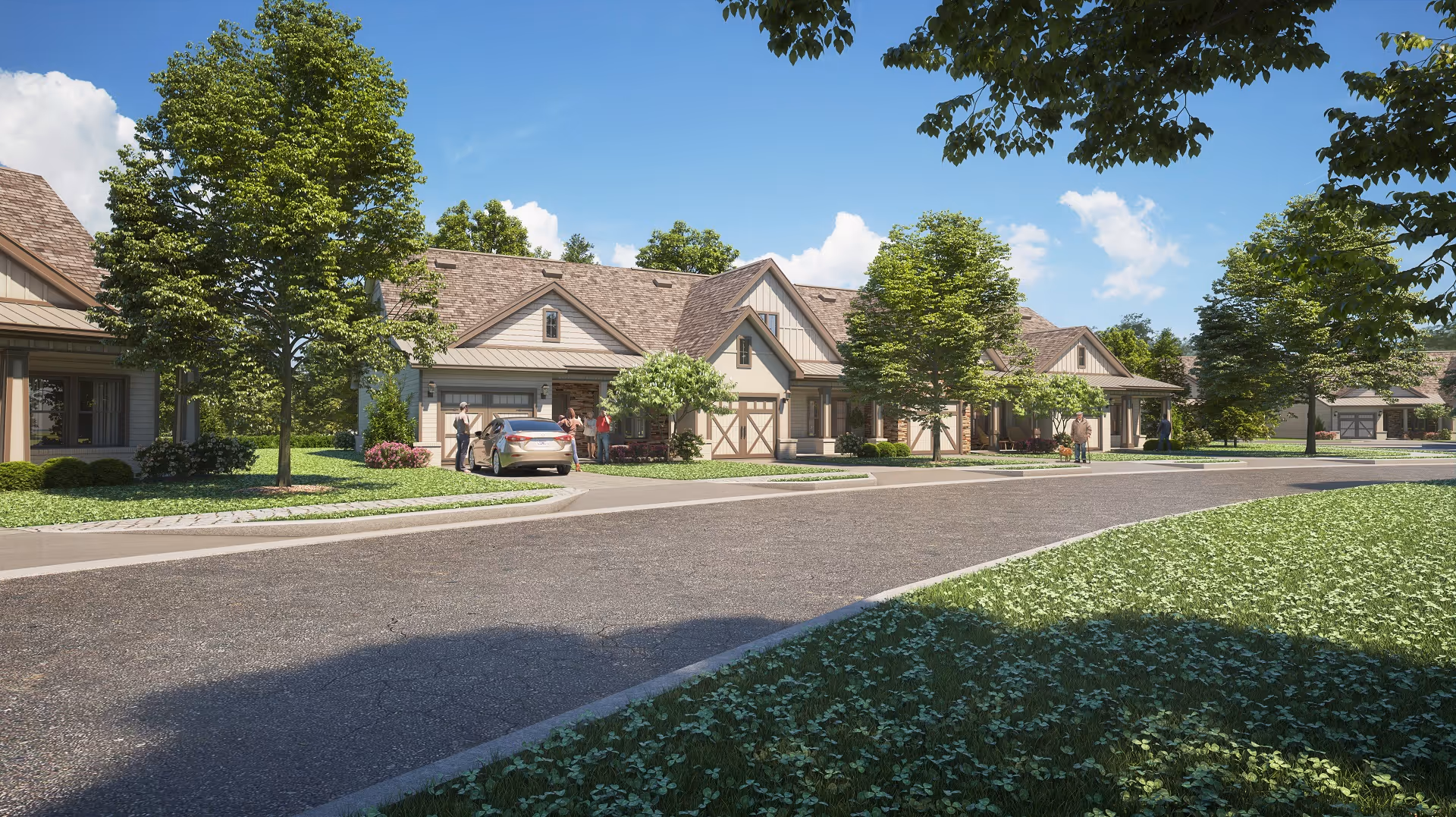 Row of beige, cottage-style senior living homes along a curved road with trees and blue sky.