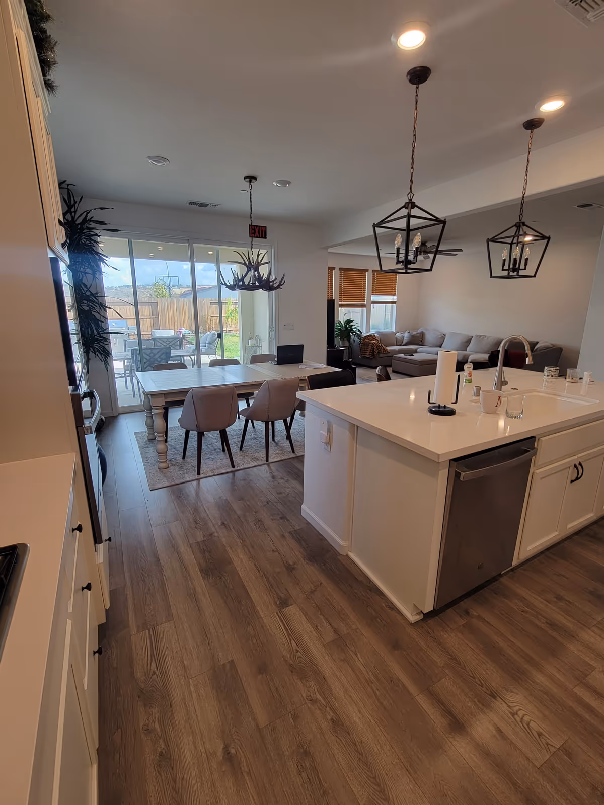 Open-plan kitchen, dining area, and living room in a senior residence.