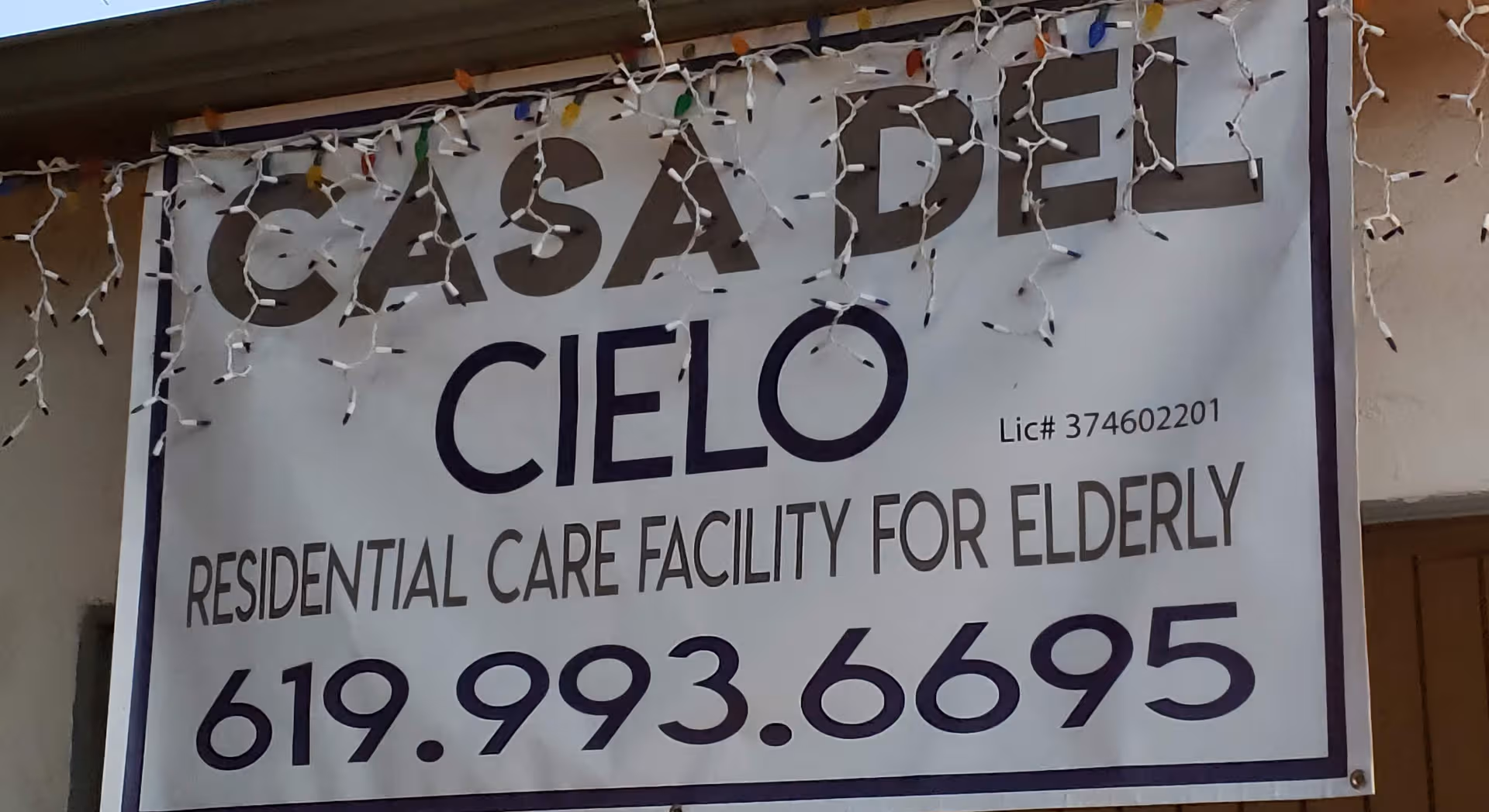 Exterior building front sign reading Casa Del Cielo Residential Care Facility for Elderly