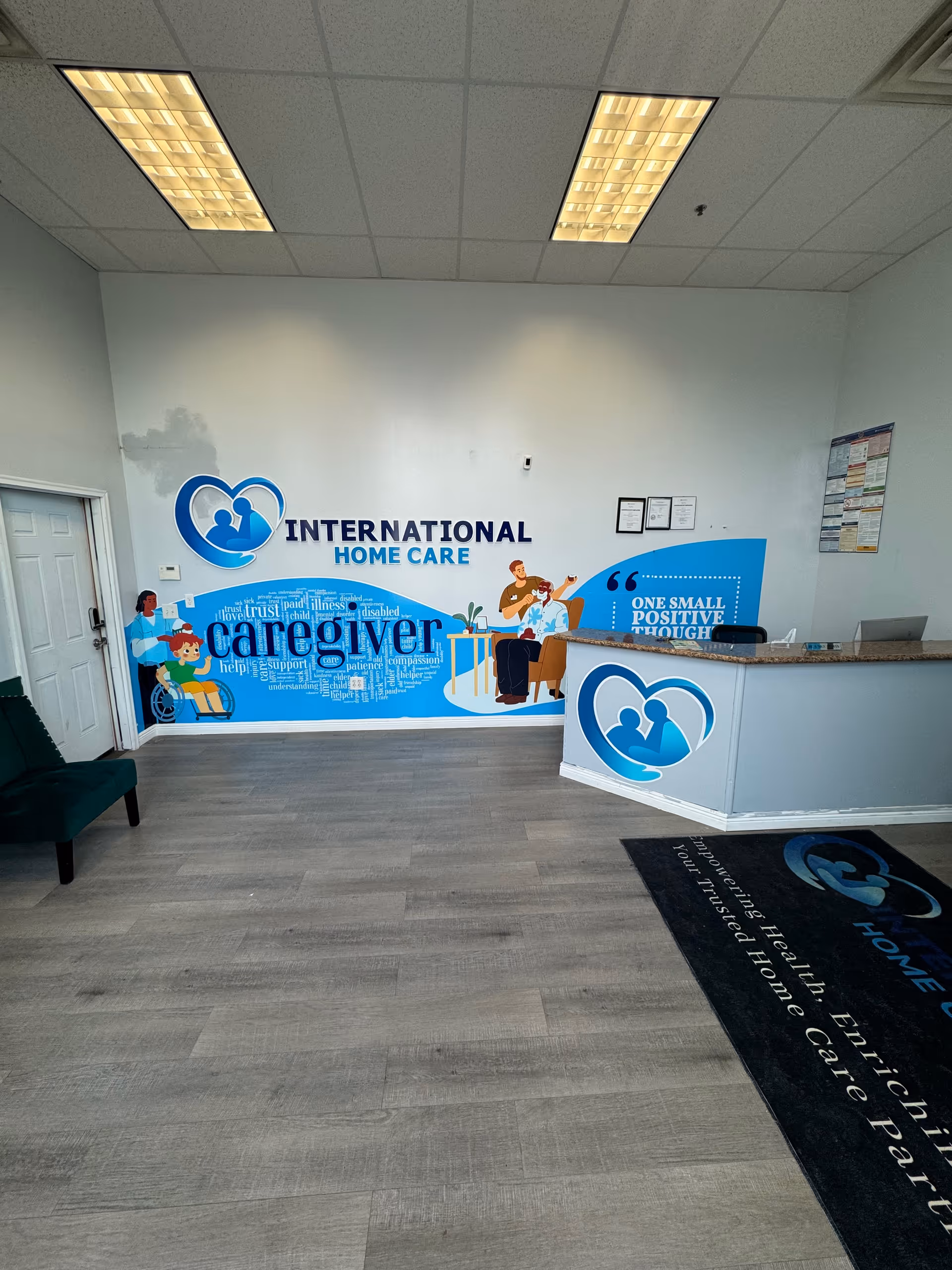 Reception area featuring a blue wall mural for International Home Care.