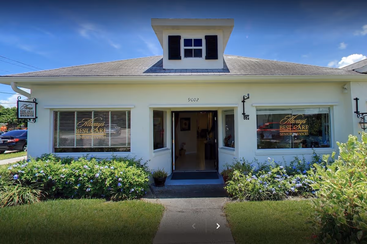 White single-story building labeled Always Best Care with front windows and flowering shrubs