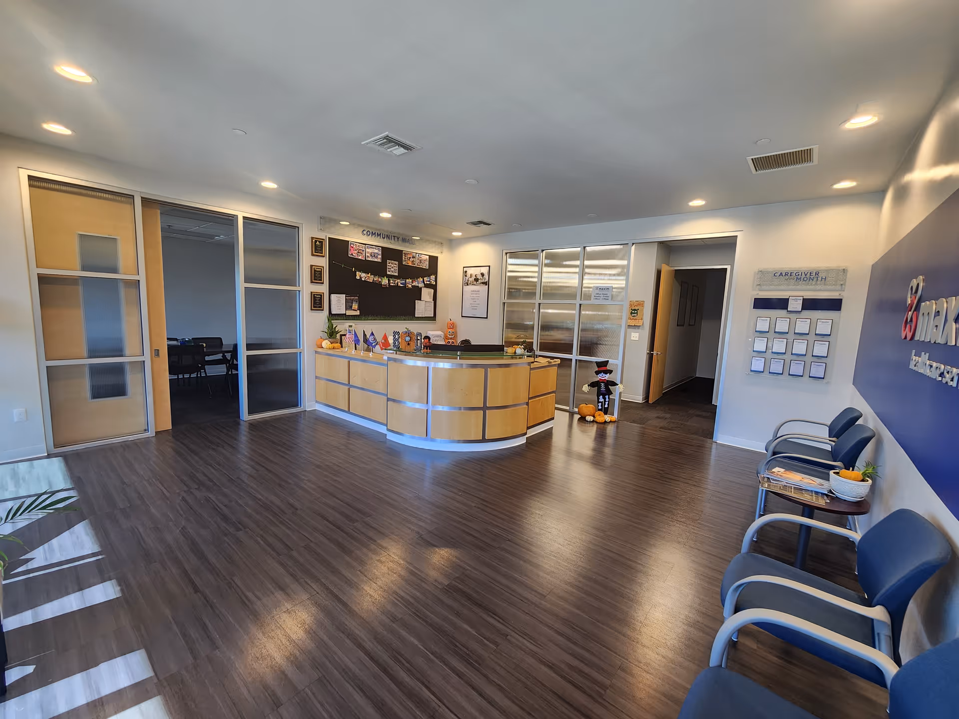 Reception desk with seating area in a Maxim Healthcare Fresno regional office lobby.