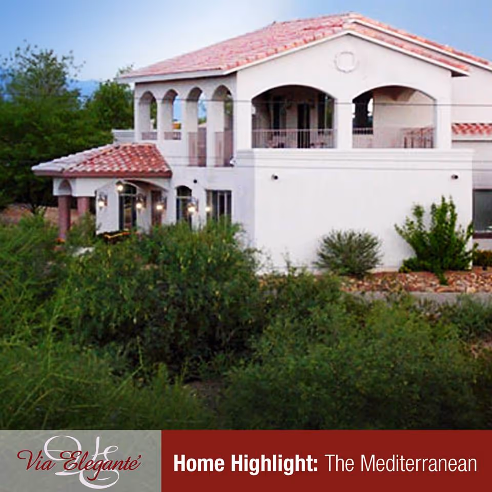 Mediterranean-style senior living facility exterior with white walls, arches, and red-tiled roof.