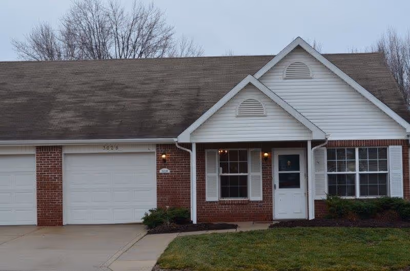 Senior living facility with brick facade and front entrance.