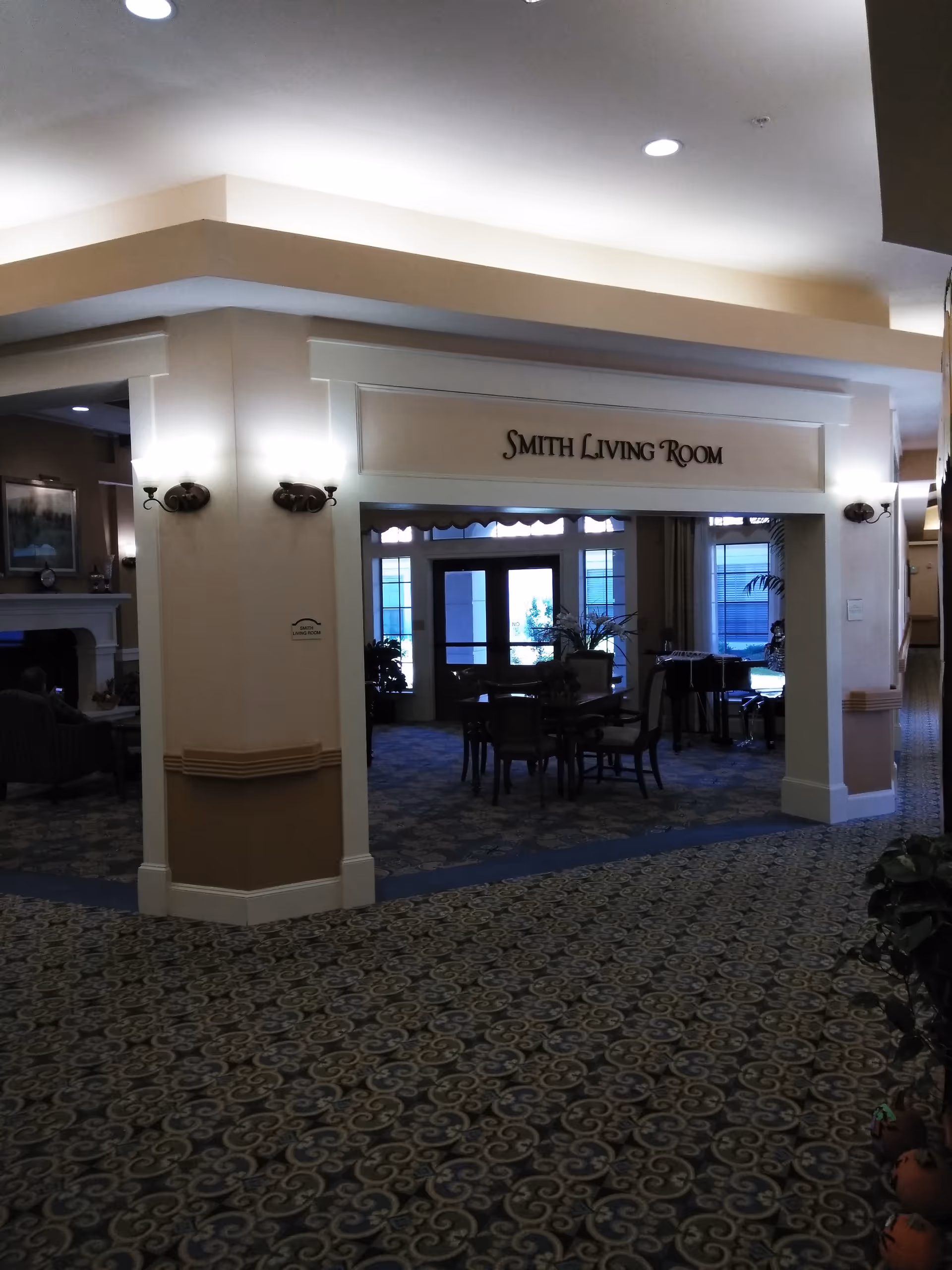 Interior lobby at Coronado at Stone Oak, Smith Living Room with tables and chairs.