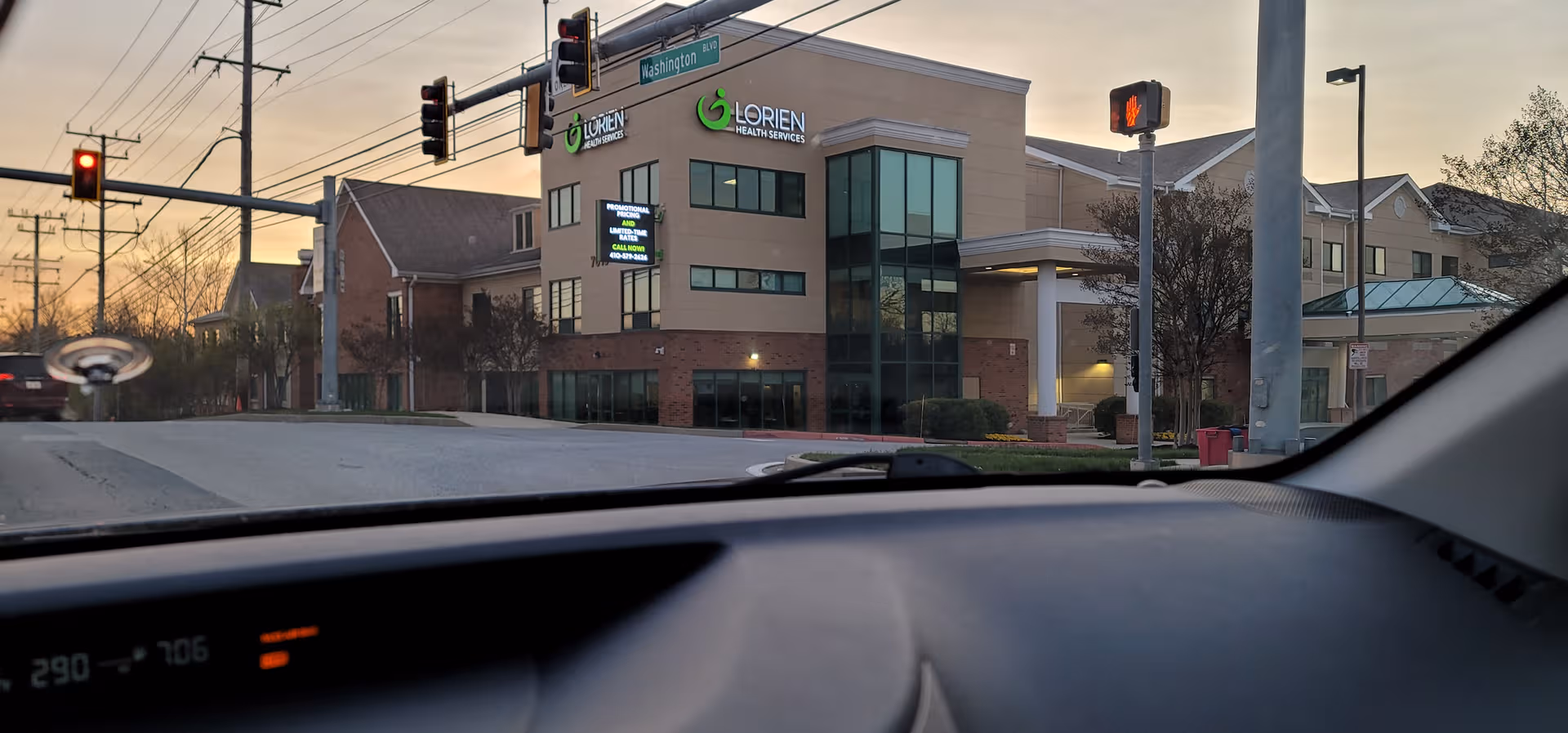 Exterior view of Lorien Elkridge senior living facility on a street corner.