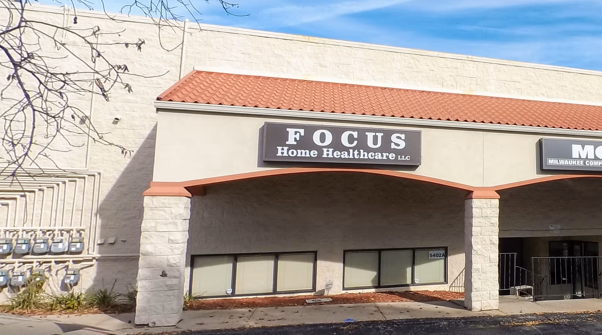 Exterior view of Focus Home Healthcare storefront with a red-tiled awning.