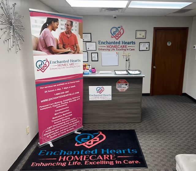 Interior reception area with Enchanted Hearts HomeCare banner and certificates on the wall.