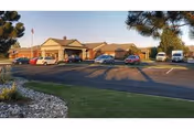 Exterior view of Life Care Center of Casper with parked cars in front