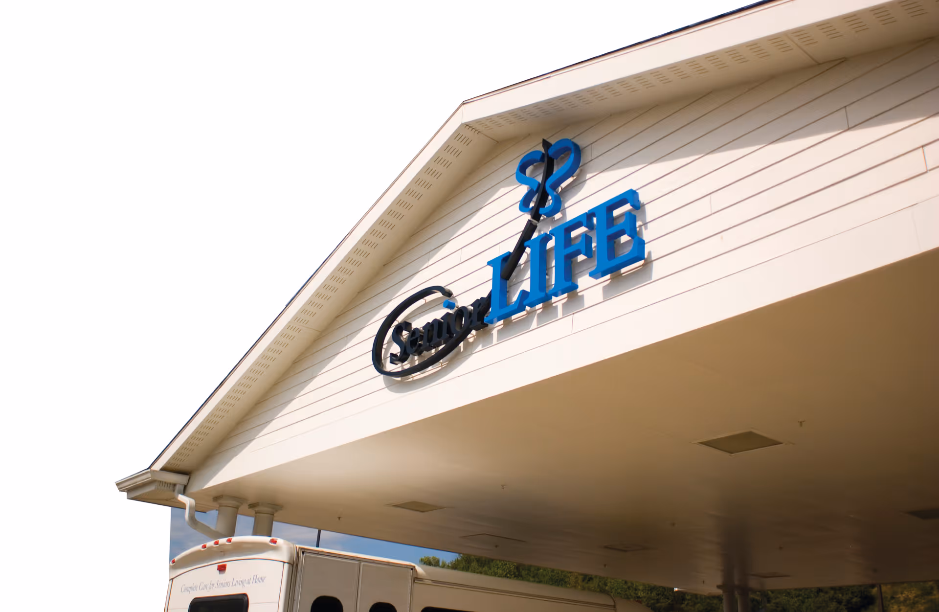 Exterior of Senior LIFE Reading facility with blue LIFE sign on the front facade.