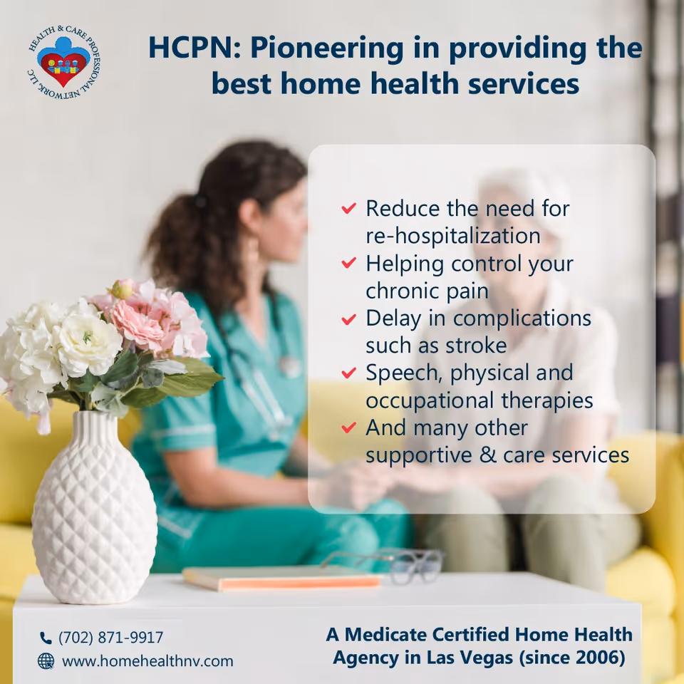 Two healthcare professionals discuss services beside a vase in a bright waiting area.
