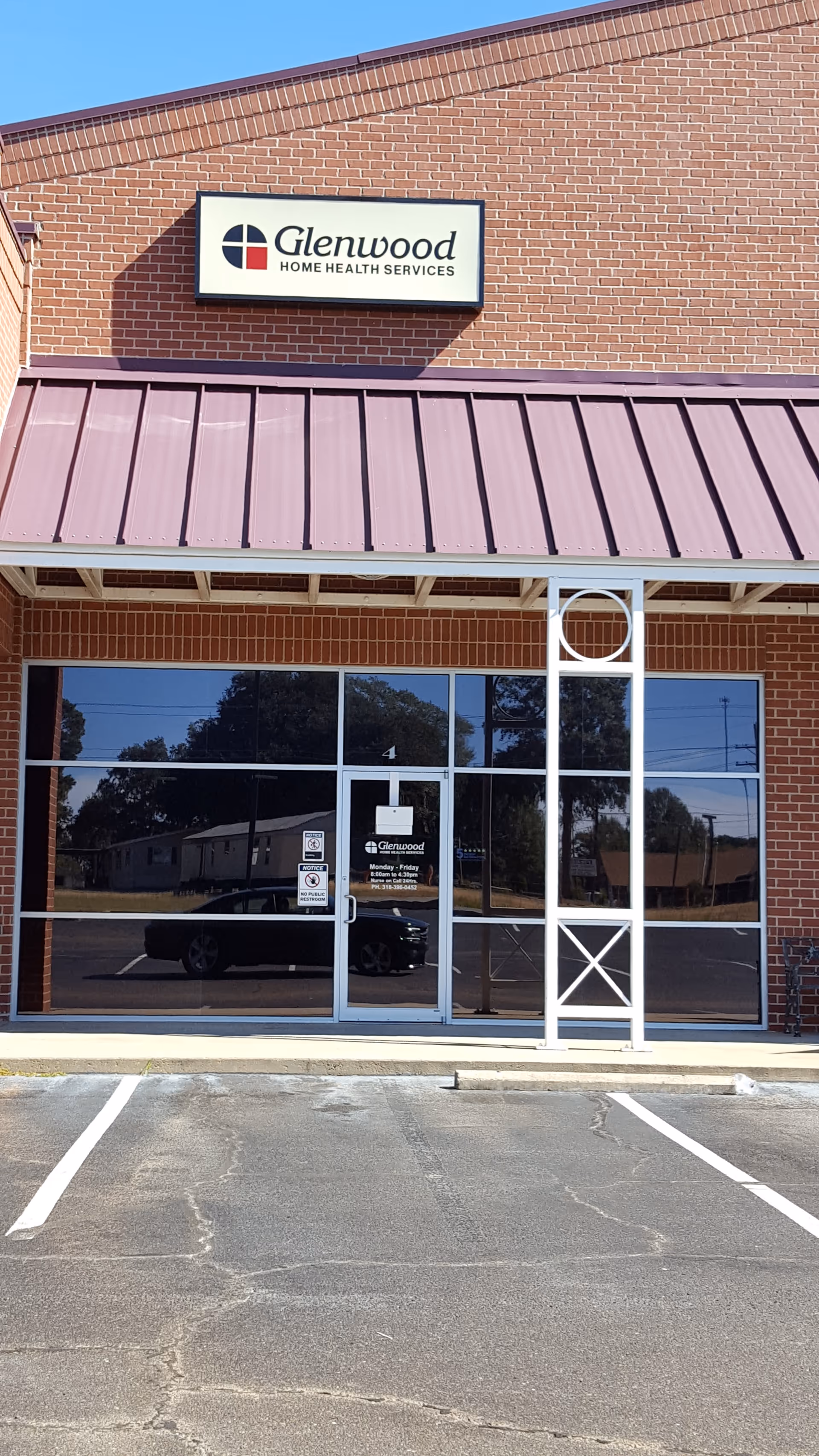 Brick-front building with Glenwood Home Health Services sign and glass entrance doors