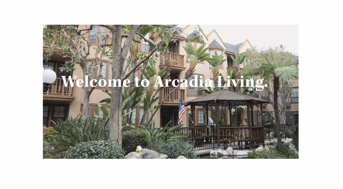 Exterior view of Arcadia Living building with landscaping and a gazebo.