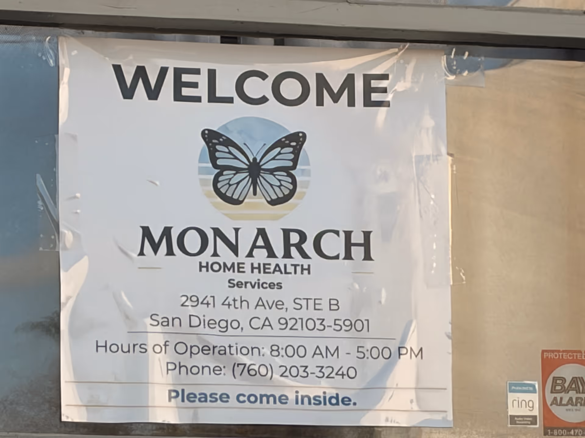 Large welcome banner for Monarch Home Health Services on a building exterior.