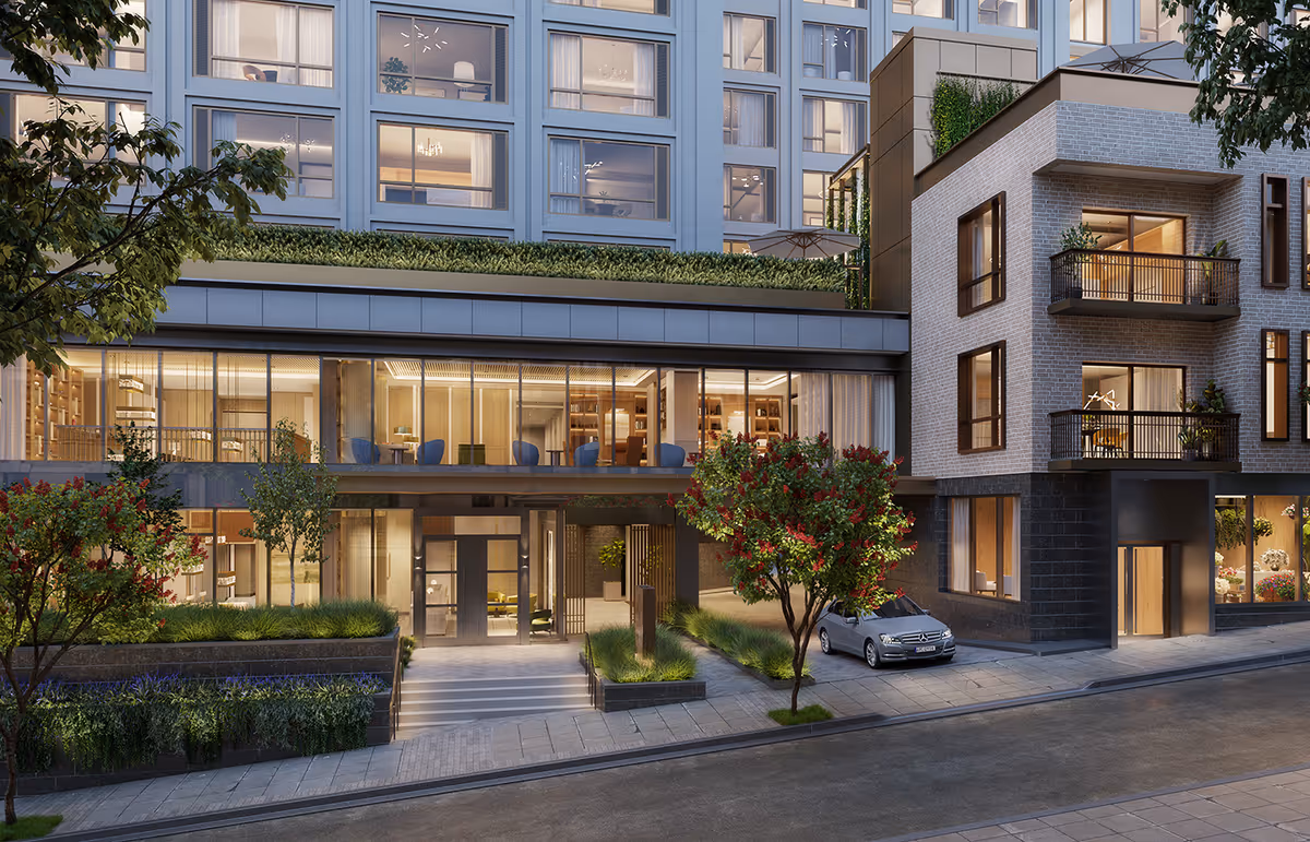 Exterior of a modern senior living building with glass windows and landscaping.