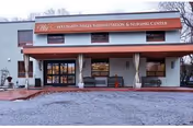 Front view of Westgate Hills Rehabilitation & Nursing Center entrance with red awning