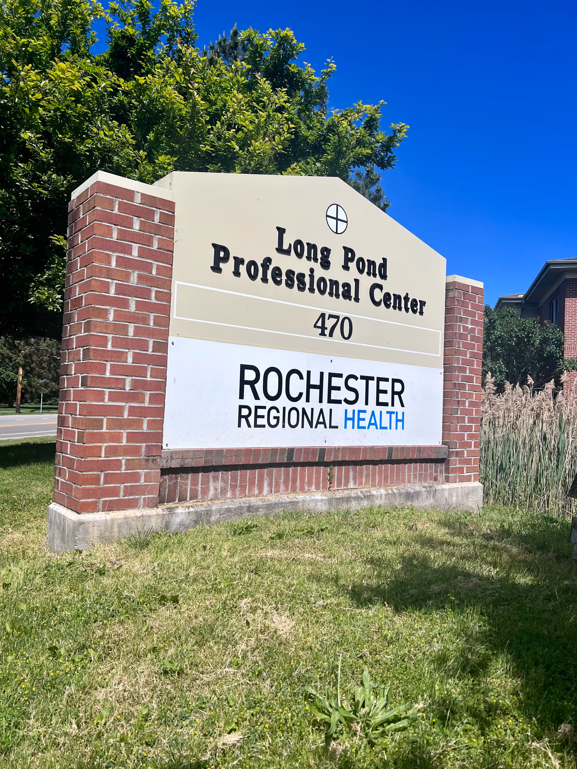 Outdoor brick sign displaying Long Pond Professional Center and Rochester Regional Health