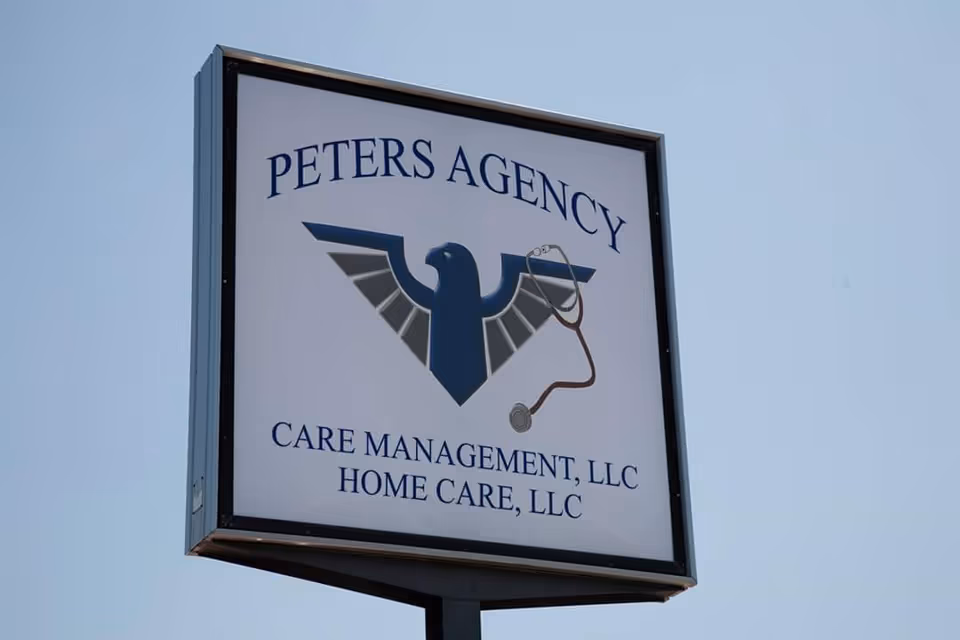 Outdoor sign for Peters Agency with stethoscope graphic