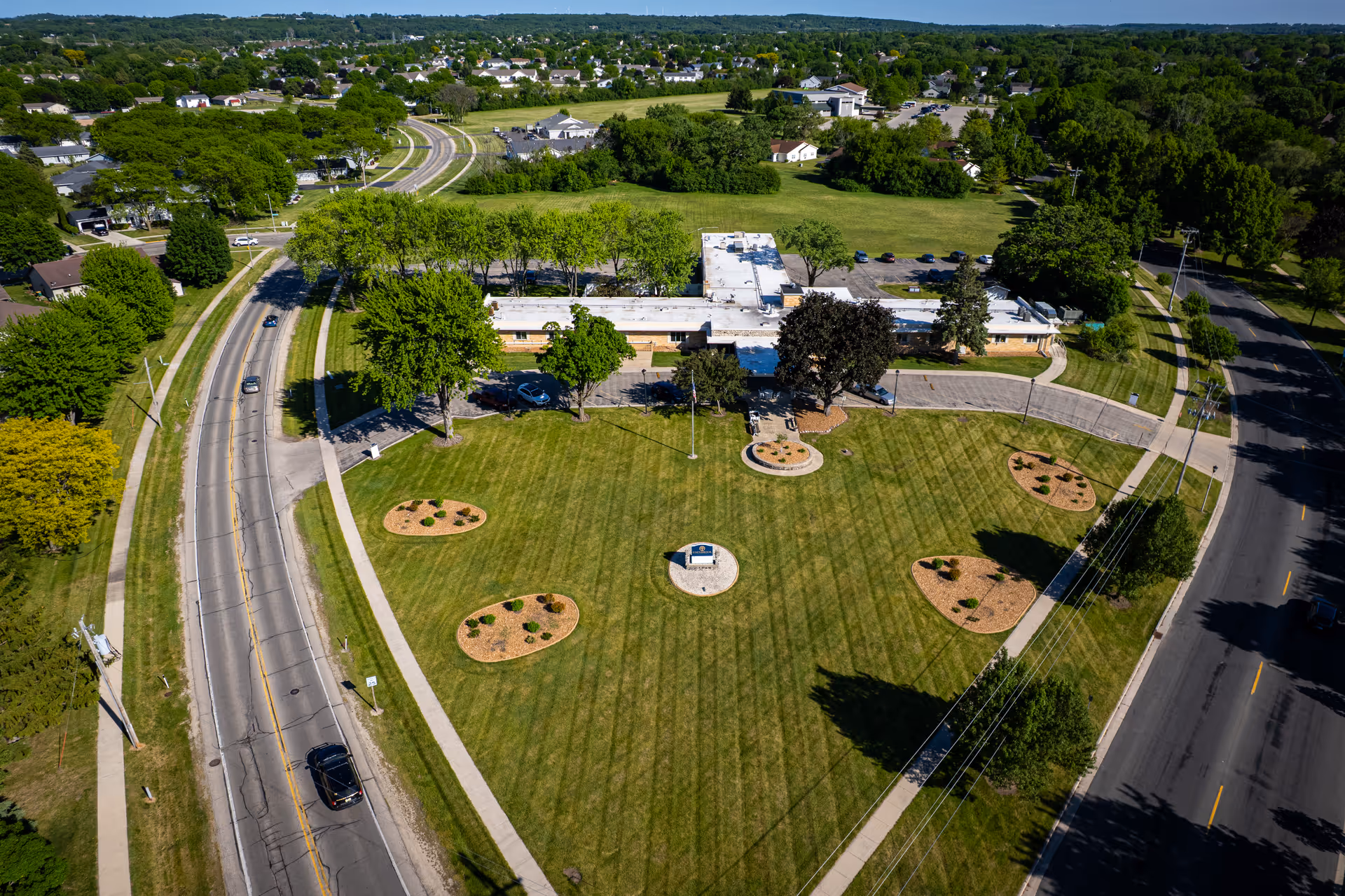 Aerial view of Edenbrook Fond du Lac campus with circular lawn, roads, and trees