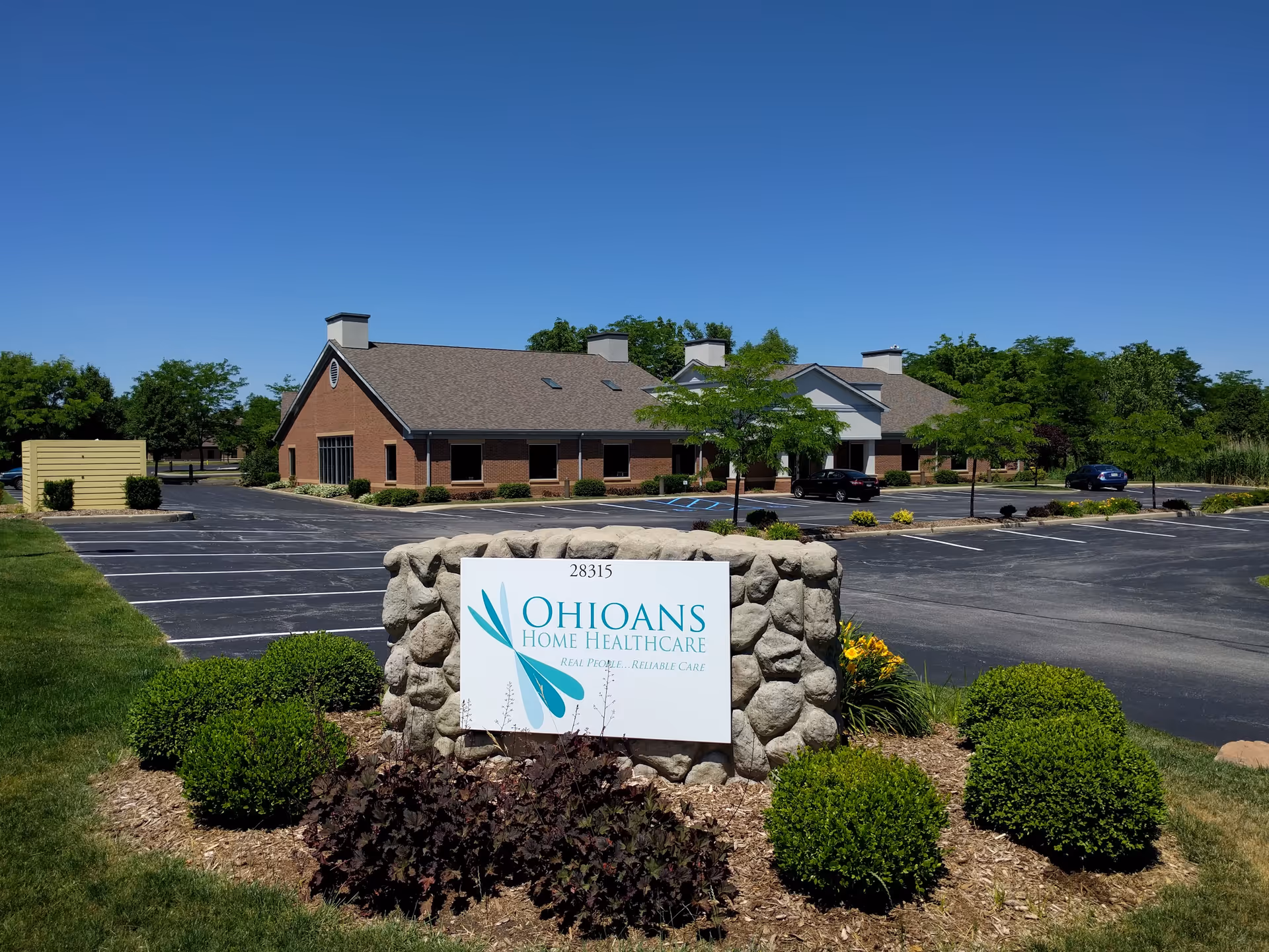 Exterior view of Ohioans Home Health & Hospice building with front sign and landscaping.