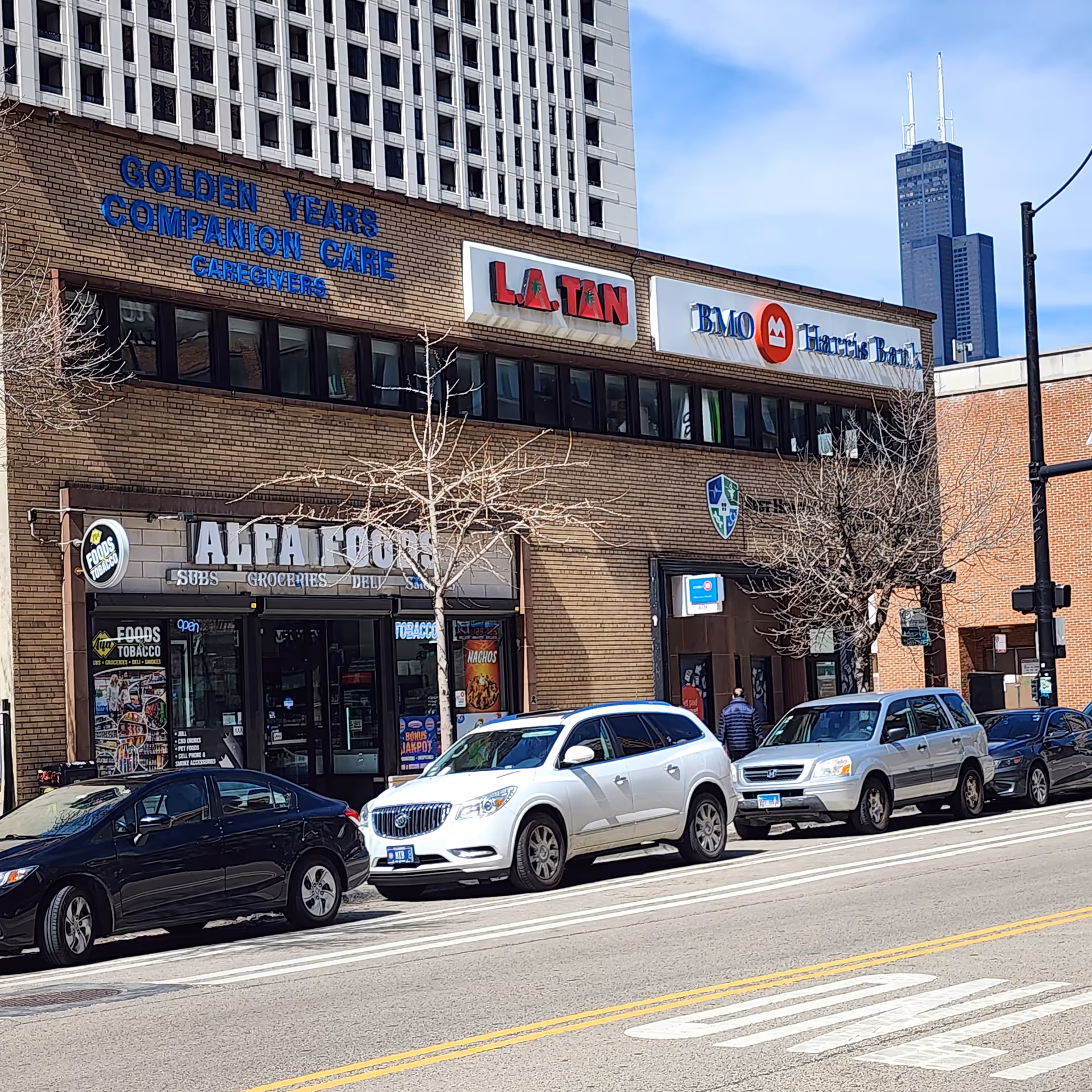 Brick building streetfront with Golden Years Companion Care sign and storefronts.