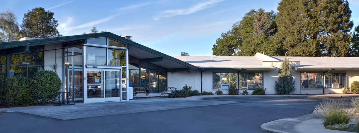 Front exterior view of Avamere Health Services of Rogue Valley with glass entrance.