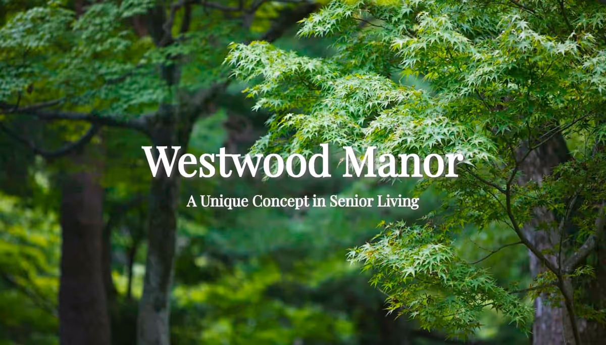 Green leafy trees in a forested area with the text 'Westwood Manor A Unique Concept in Senior Living' overlaid in white.