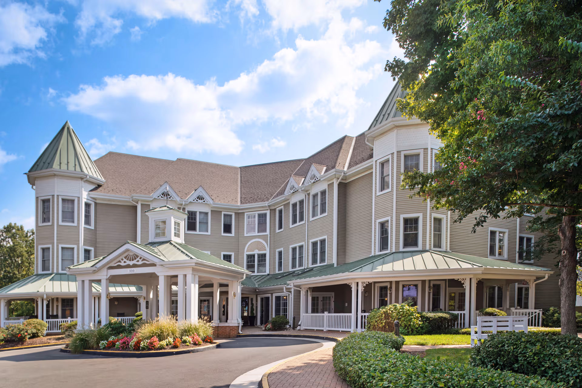 Sunrise of Findlay senior living facility exterior with a covered front entrance and landscaping.