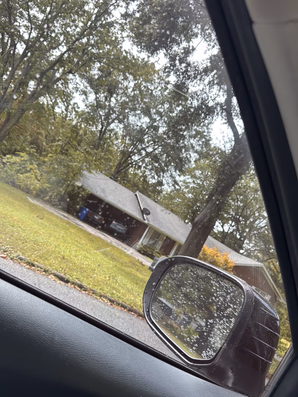Exterior view of Autumn House Personal Care Home with a driveway and parked cars
