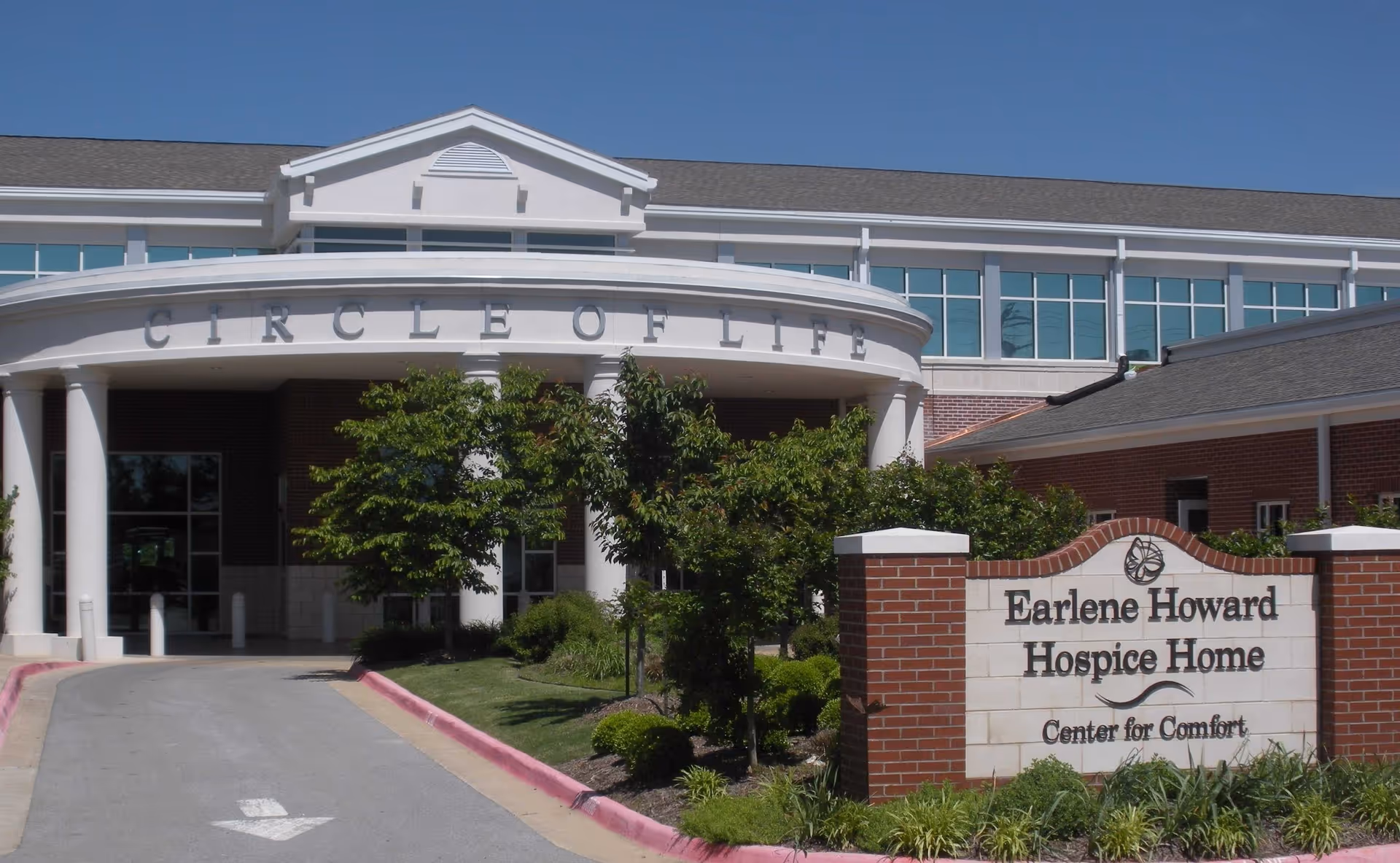 Front view of Circle of Life entrance with Earlene Howard Hospice Home sign.