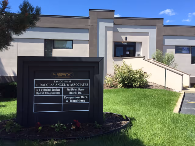 Exterior view of the Companion Care facility with a sign and ramped entrance.