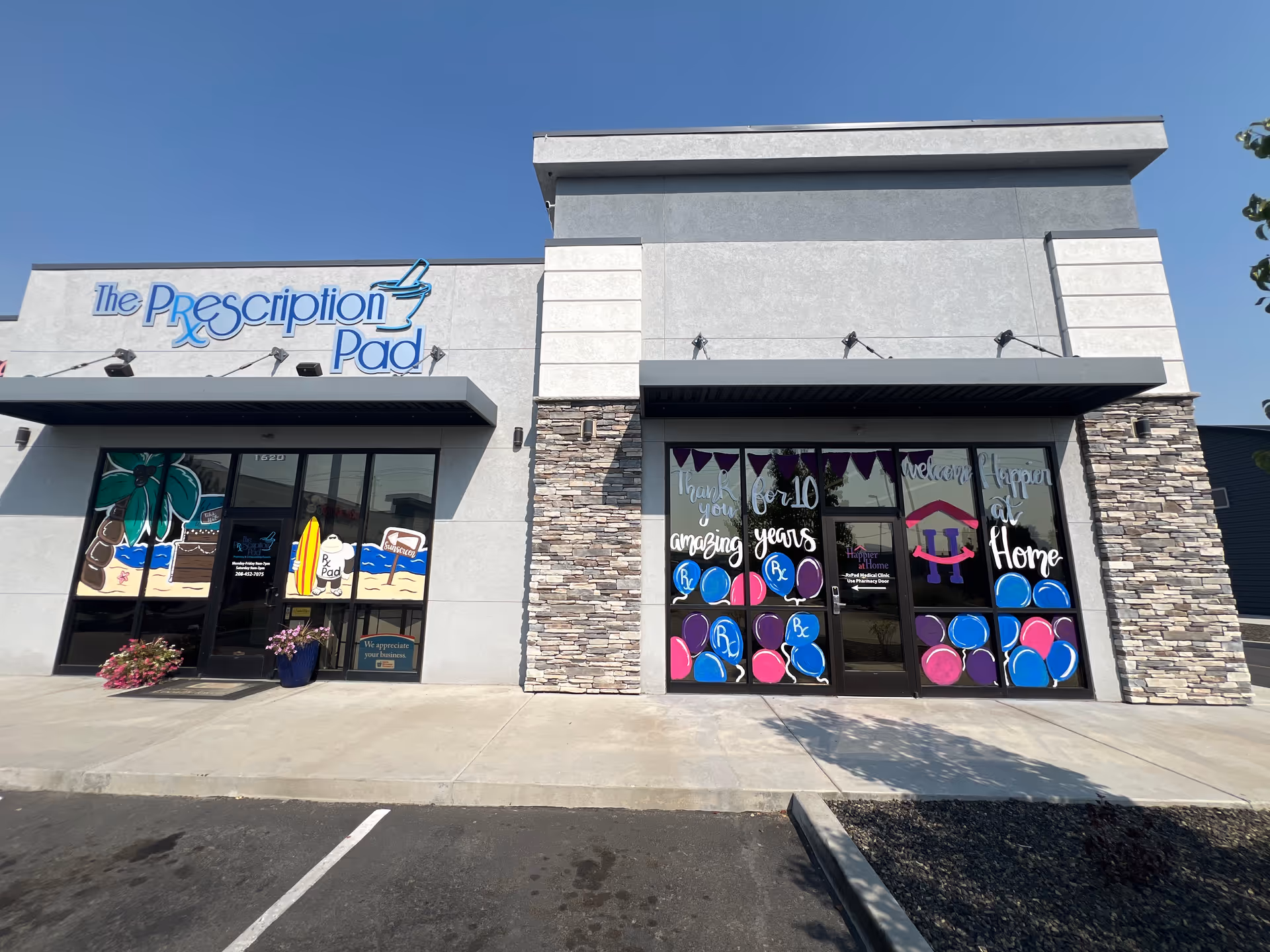 Exterior storefront with The Prescription Pad sign and decorated windows.