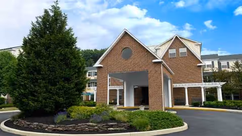 Atria Bethlehem exterior building with a brick front entrance, circular driveway, and landscaped grounds.