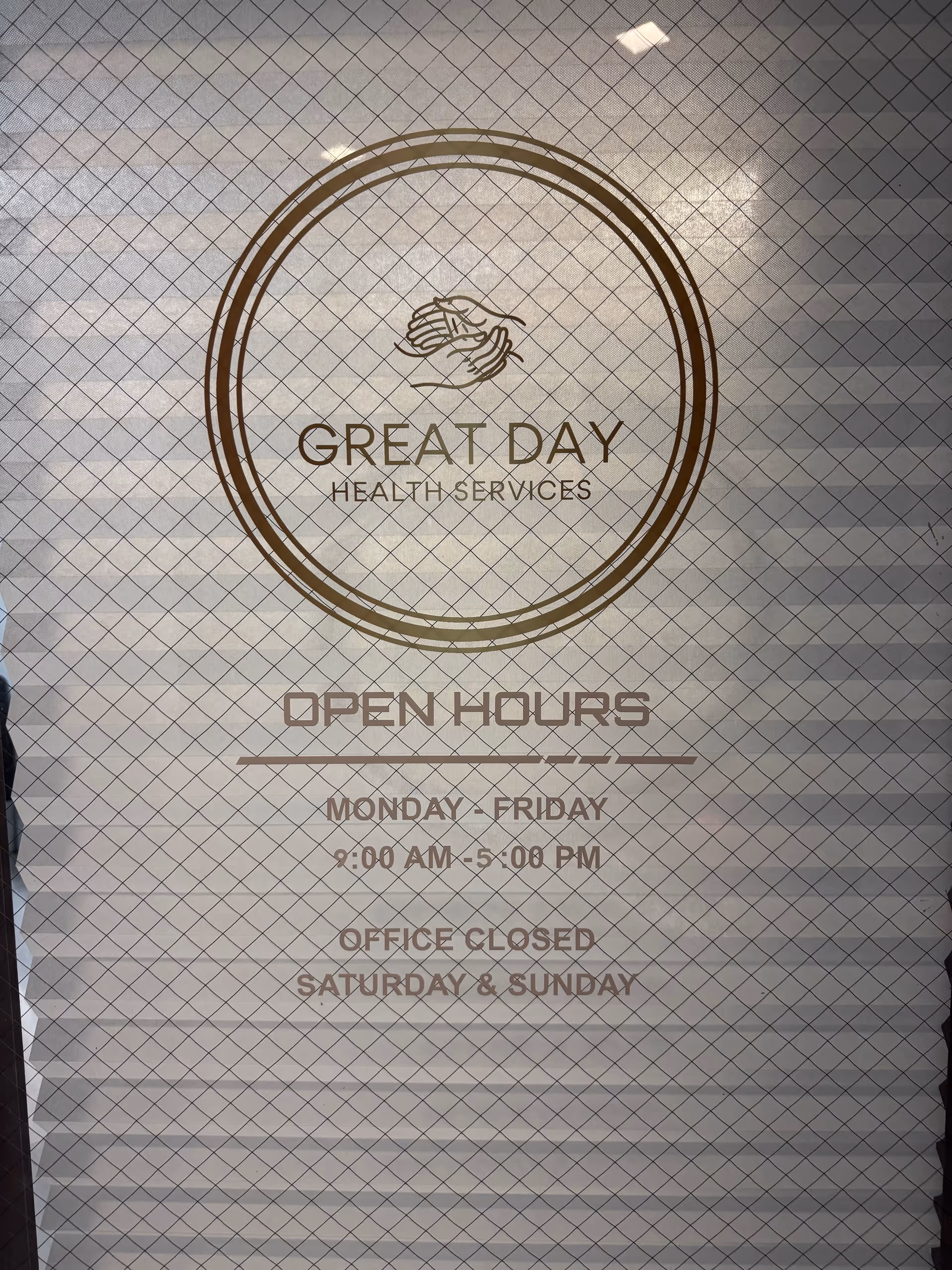 Glass door sign shows Great Day Health Services logo and open hours.