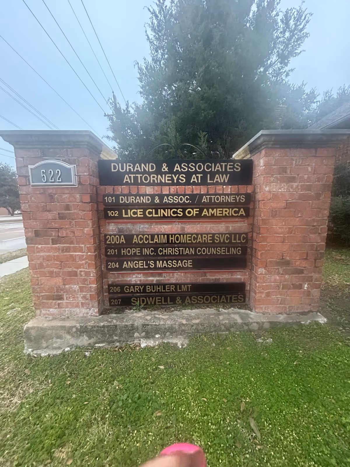 Brick directory sign outdoors listing Acclaim Homecare Svc LLC among tenants.