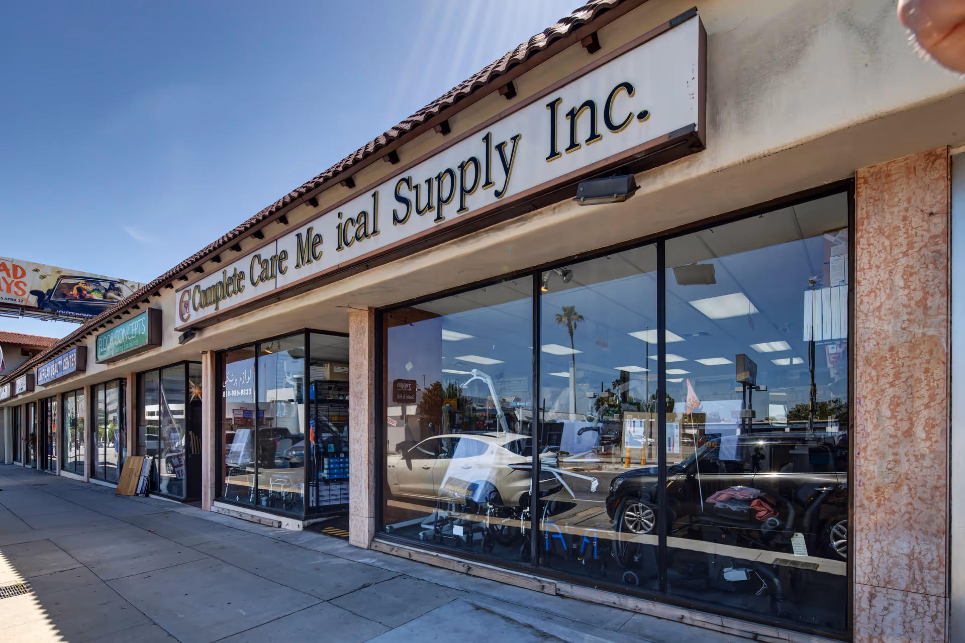 Exterior view of a storefront with large glass windows and Complete Care Medical Supply Inc. sign.