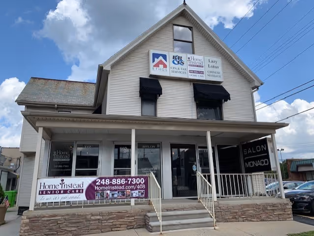 Two-story building with Home Instead senior care signs and a storefront entrance.