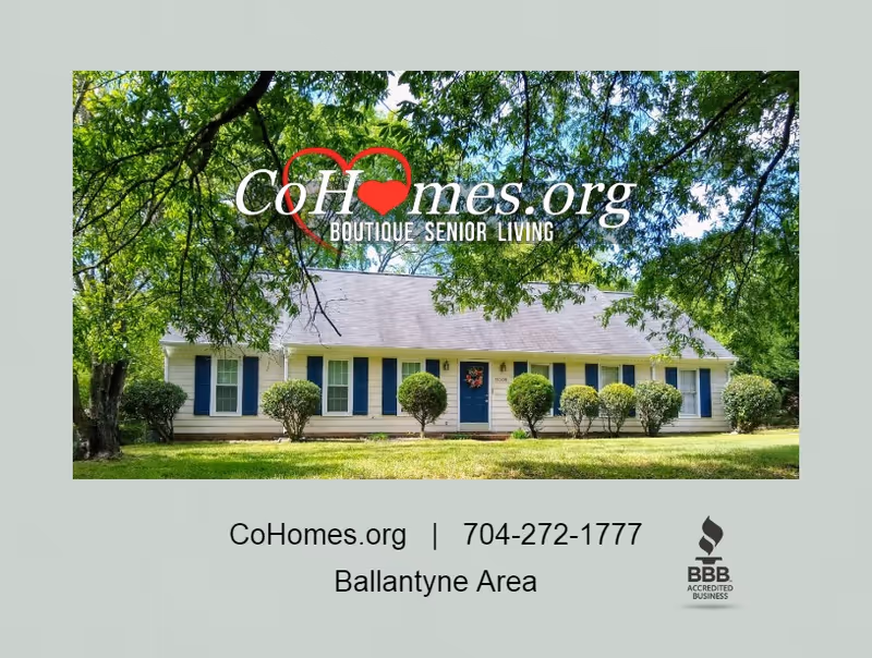 Single-story building with blue shutters, trimmed bushes, and a CoHomes logo overlay.