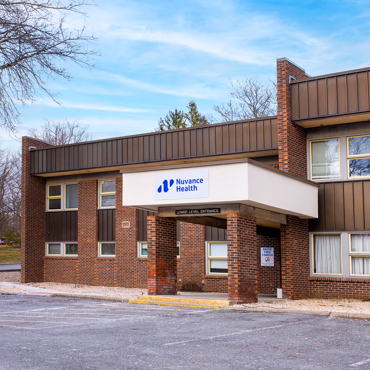 Brick building with a Nuvance Health sign and covered entrance.