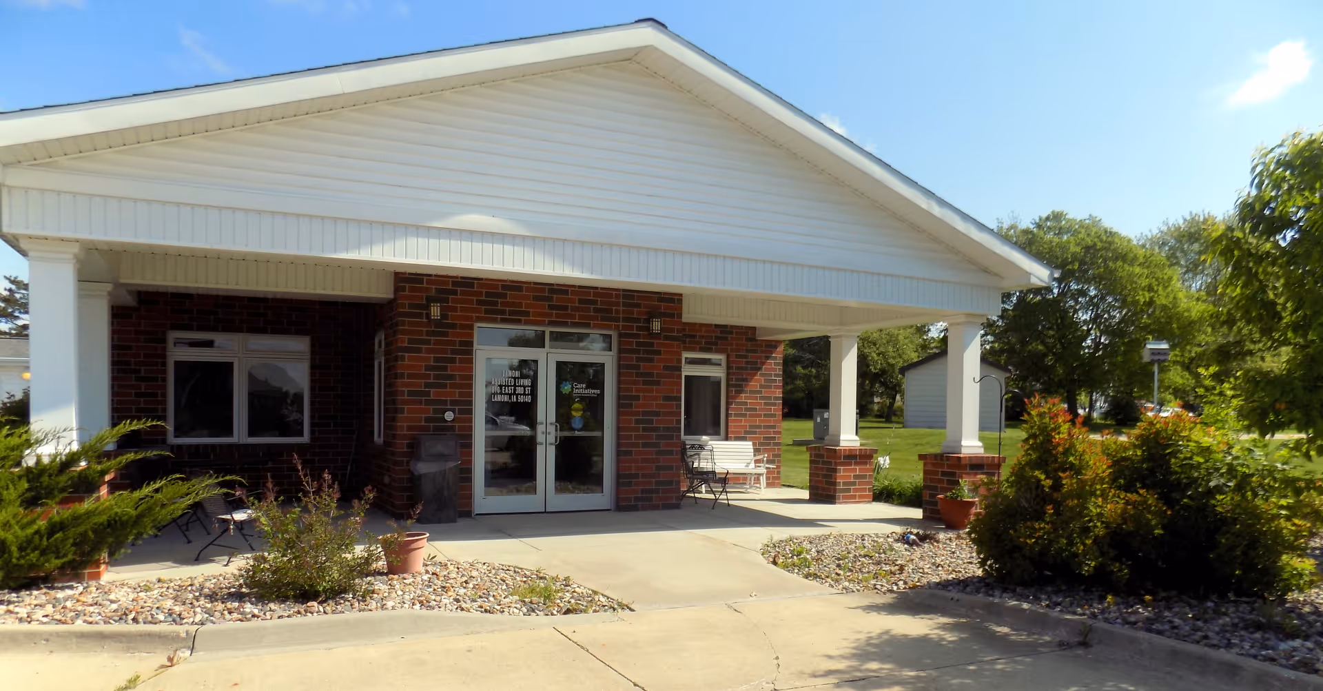 Lamoni Independent Living exterior with brick facade and a covered entrance