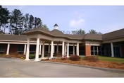 Front view of Stevens Park Health and Rehabilitation with columns and brick exterior.