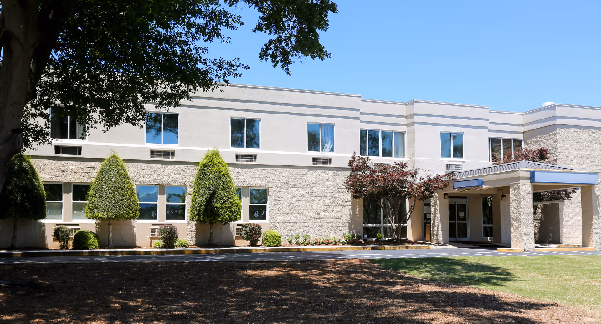 Northridge Health and Rehabilitation exterior: a two-story building with entrance under a canopy and landscaped grounds.