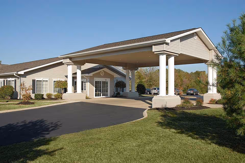Single-story senior living facility with a porte-cochere entrance and driveway.