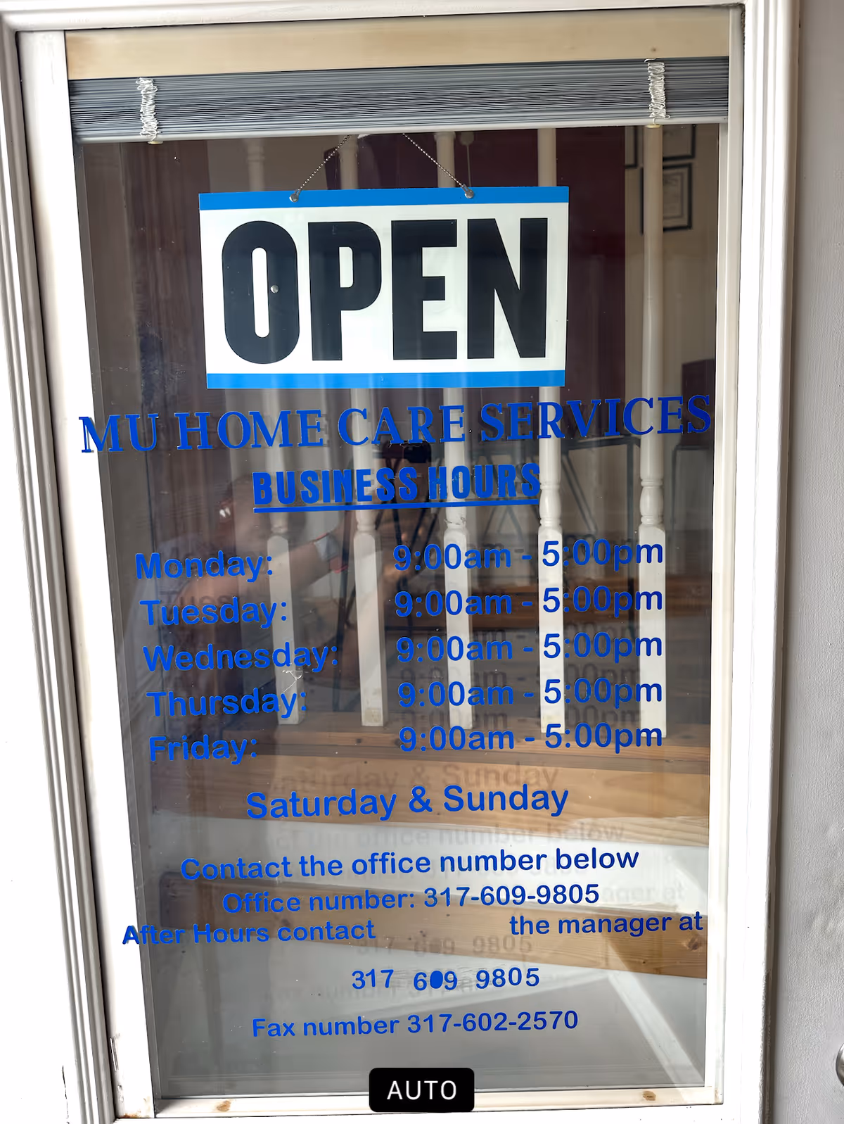 Front window of MU Home Care Services shows an OPEN sign and hours.