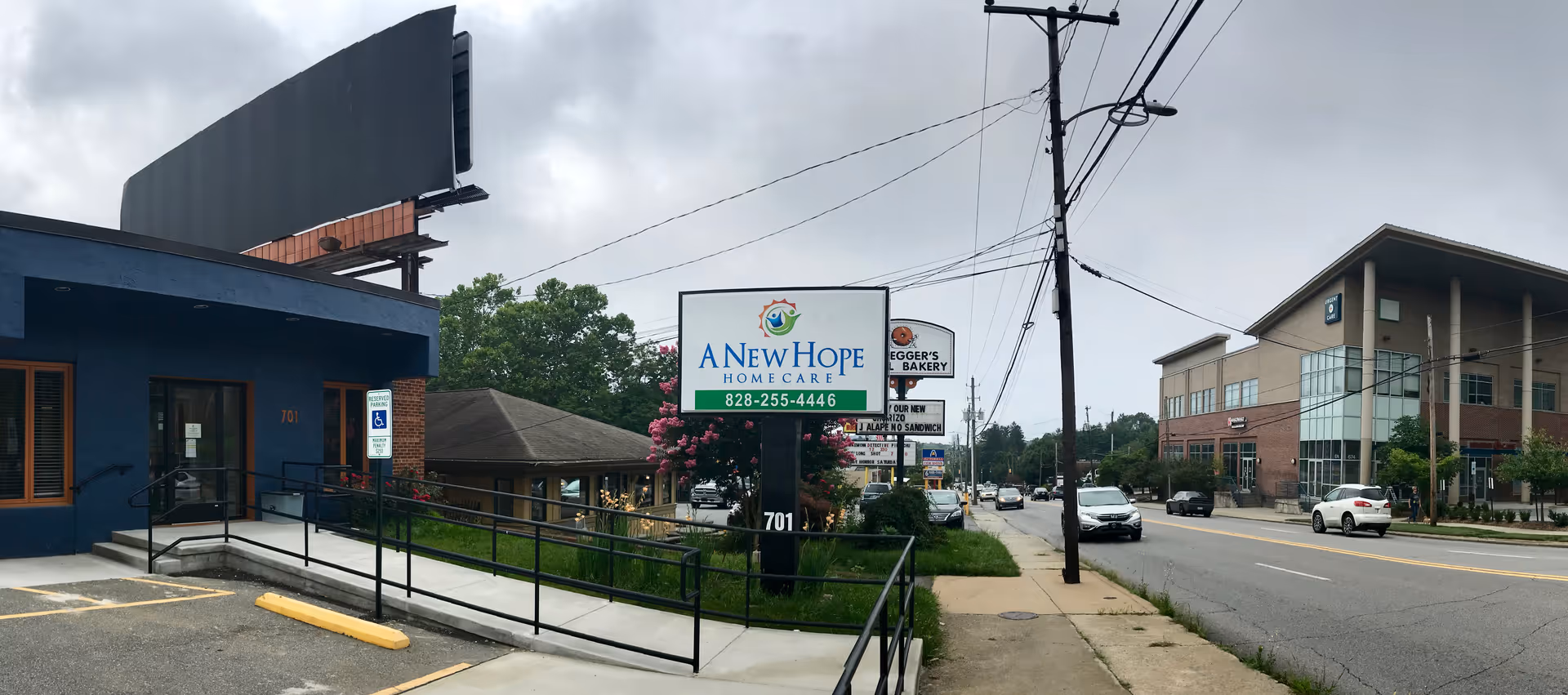 Exterior street view with a blue building and A New Hope Homecare sign.