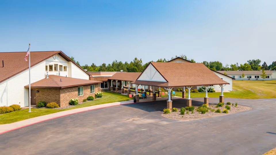 A senior living facility with a covered entrance and circular driveway.