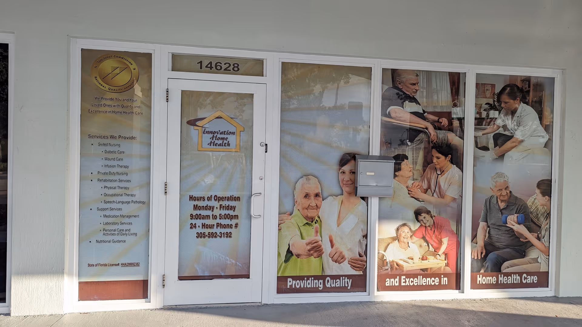Storefront with glass doors and large posters for Innovation Home Health on the windows